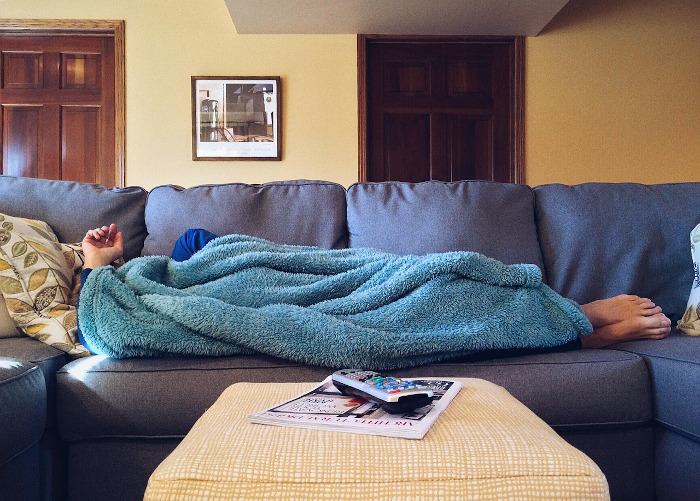 person sleeping on a couch 