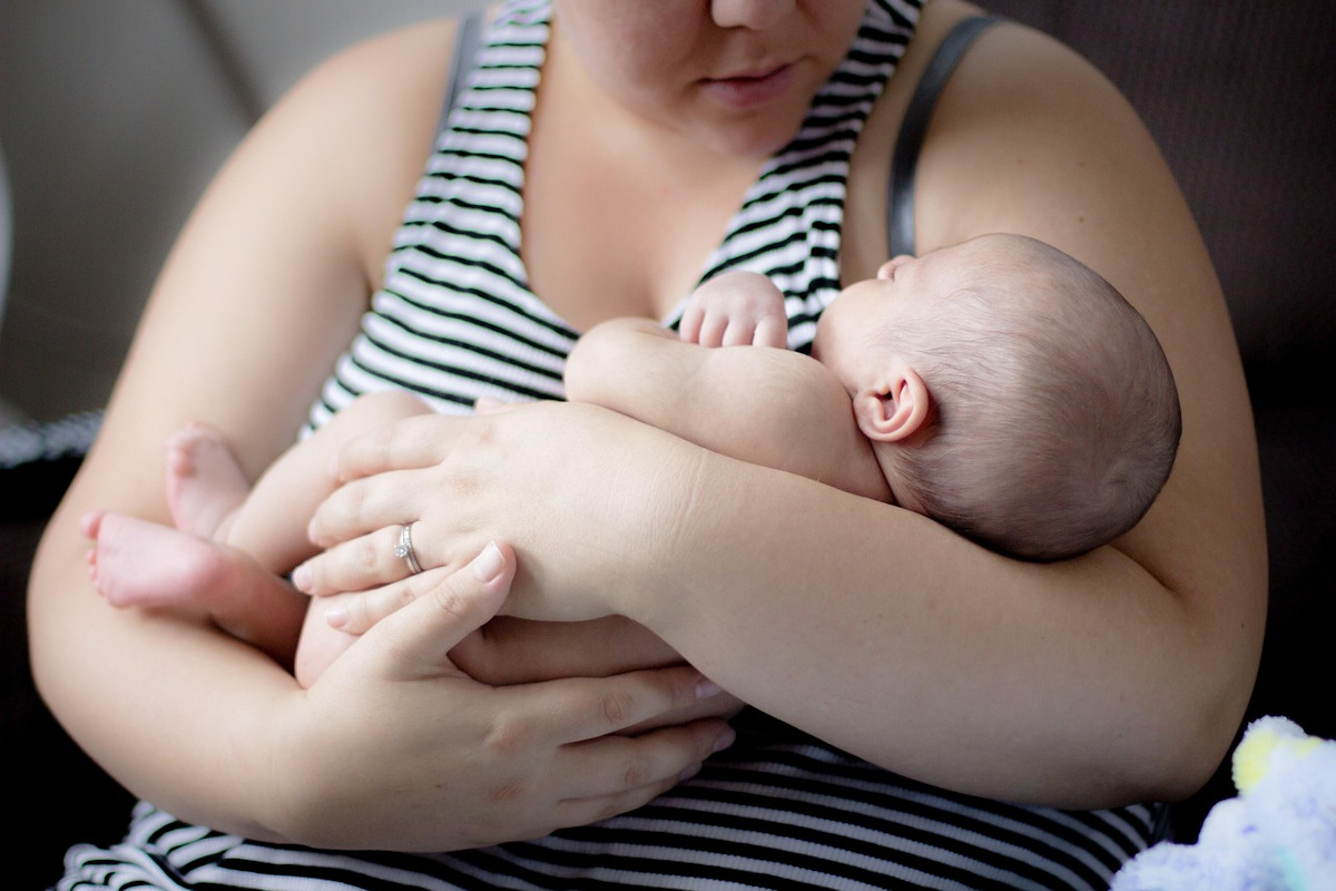 mother holding her young baby
