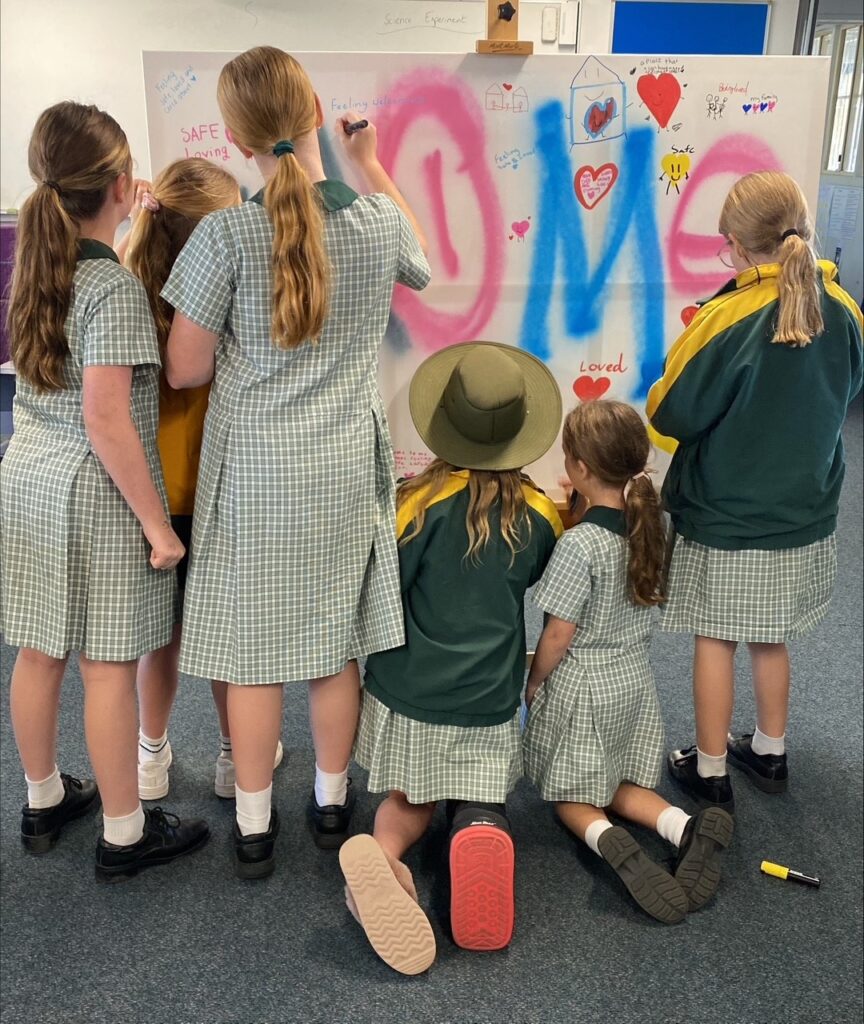 students making sign to advocate for homelessness