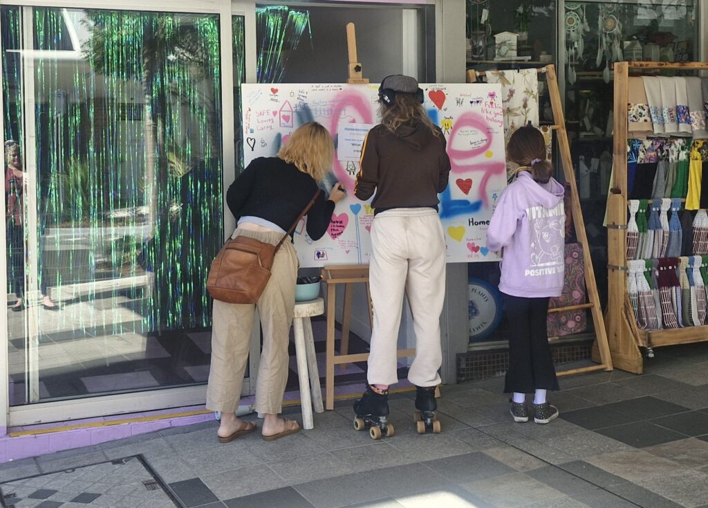 students making sign for homelessness advocation